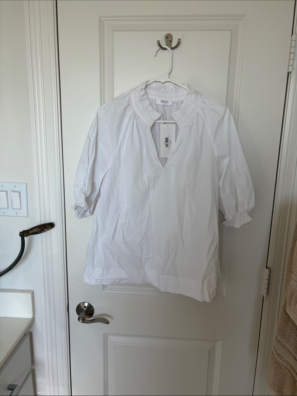 Women’s white ruffled top